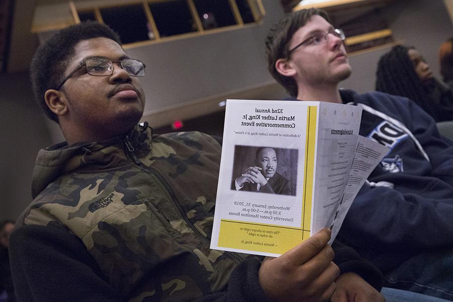 A student holds a pamphlet about Martin Luther King Jr.