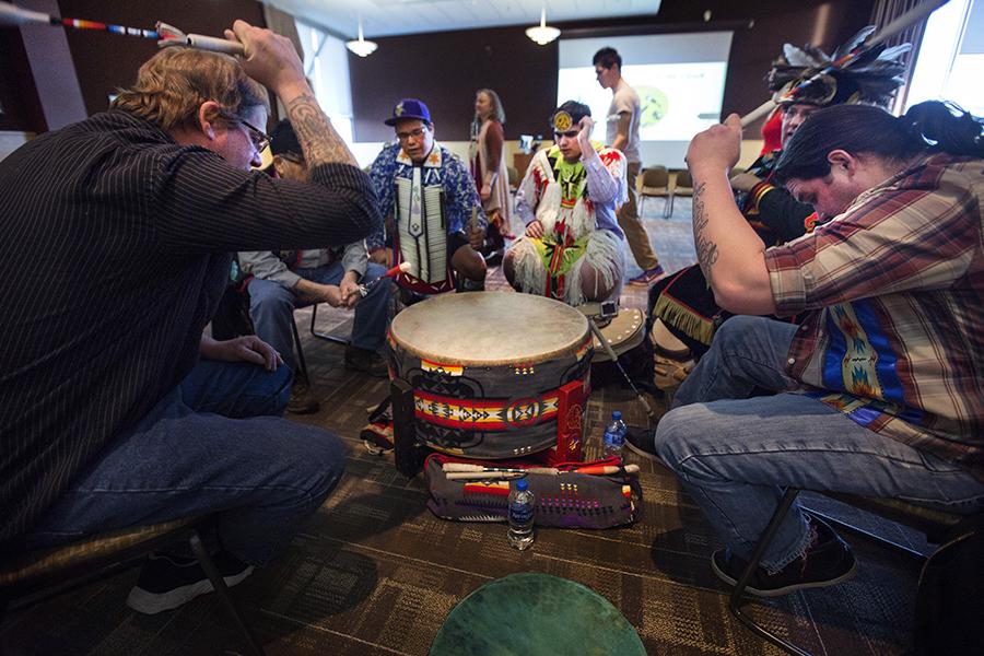 Six members of the Red Cliff Band of Lake Superior Chippewa perform traditional drumming.